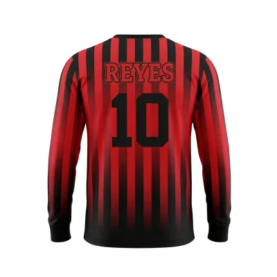 Soccer player wearing long sleeve birdseye mesh jersey demonstrating breathability during warm weather match