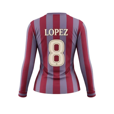 Athlete in a long sleeve spandex V-neck soccer jersey demonstrating stretch and movement