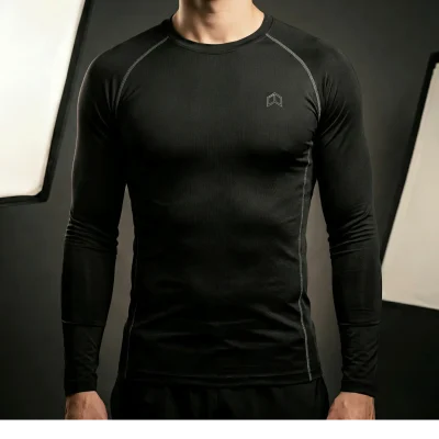 Athlete in a tight black long sleeve compression base layer jersey