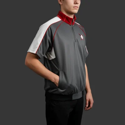 Baseball windbreaker jacket with short sleeves, a quarter zip, and an embroidered team logo on the chest