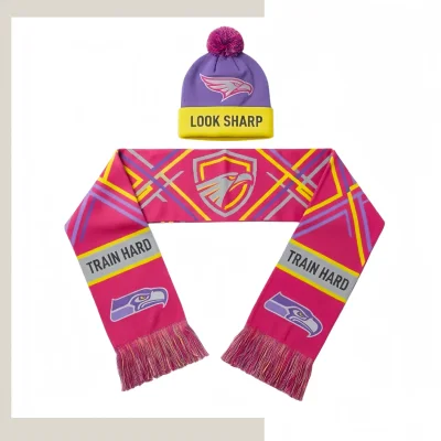 Custom coordinated reversible pom pom beanie and scarf set with matching jacquard patterns on a white background