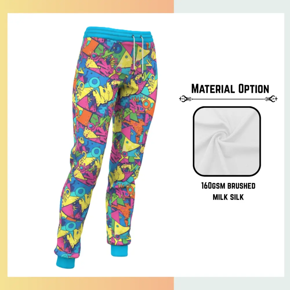 Custom full sublimation printed 160gsm brushed milk silk lounge pants for unisex and kids laid flat, showcasing vibrant design on ultra-soft fabric with elastic waistband, drawcord, and side pockets.